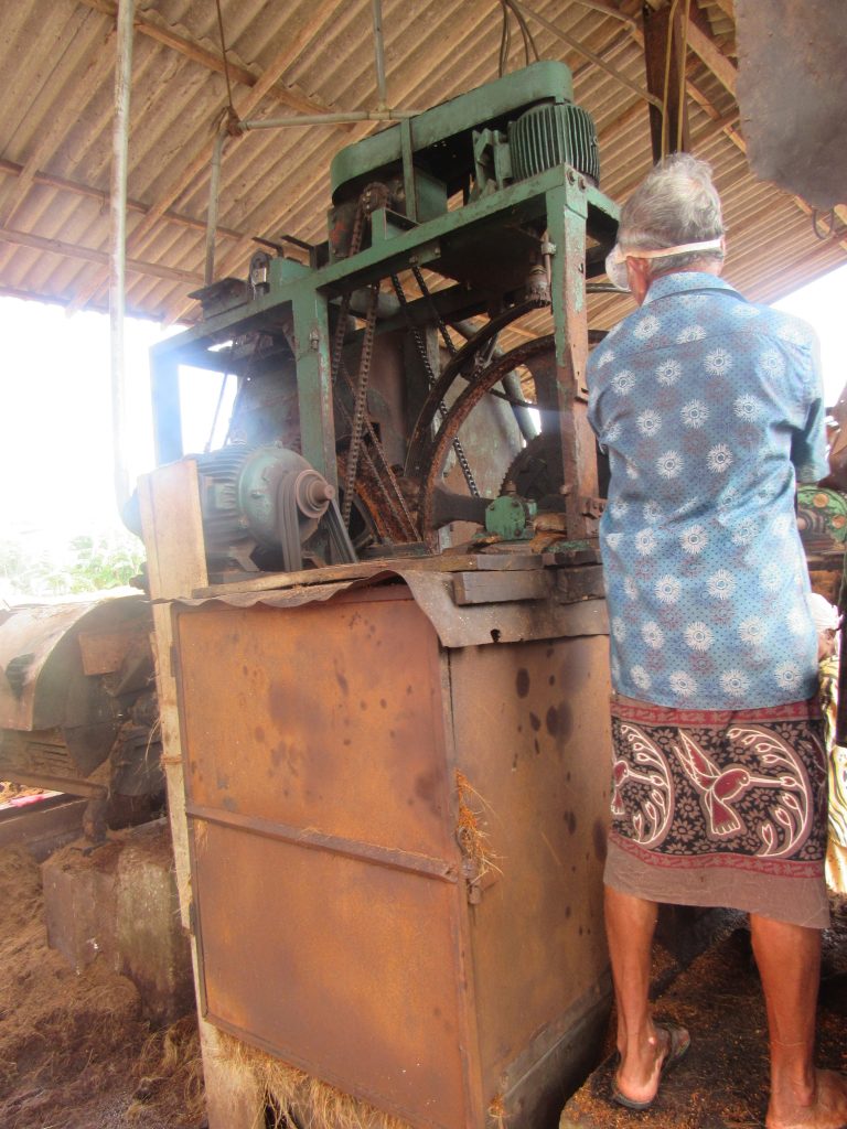 Coir Mill worker with machinery